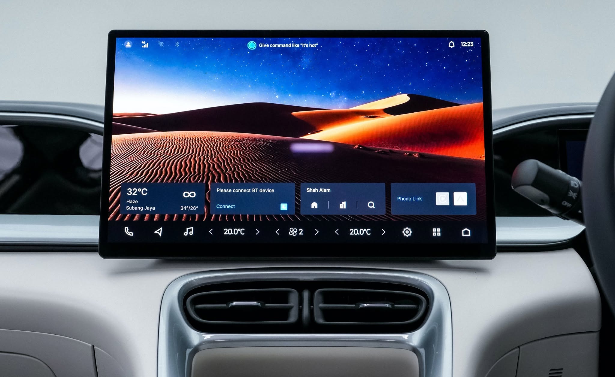 Proton e.MAS 5 14.6-inch FHD display head unit running Apple CarPlay with the crystal gear selector below